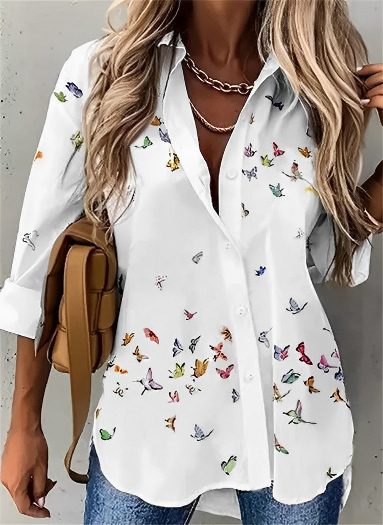 The primary color in the image is white. The other colors visible from the butterfly patterns do not match the specified color prints. Thus, the response is:

**white**