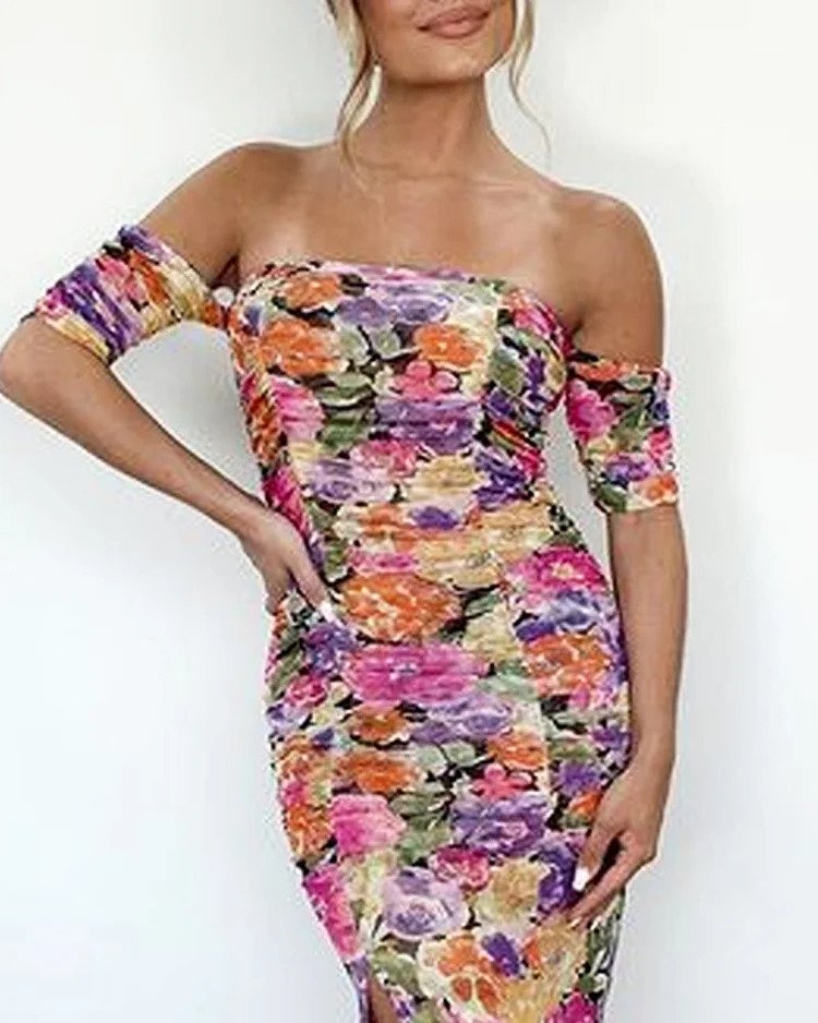 The dress features a mix of colors including purple, pink, orange, yellow, and green. The overall pattern is floral, creating a vibrant and colorful appearance.